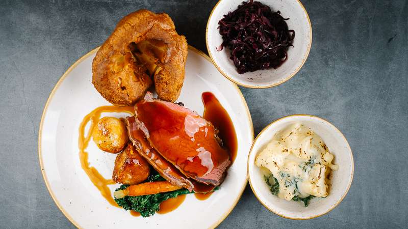 roast beef with roast potatoes, red cabbage and cauliflower cheese