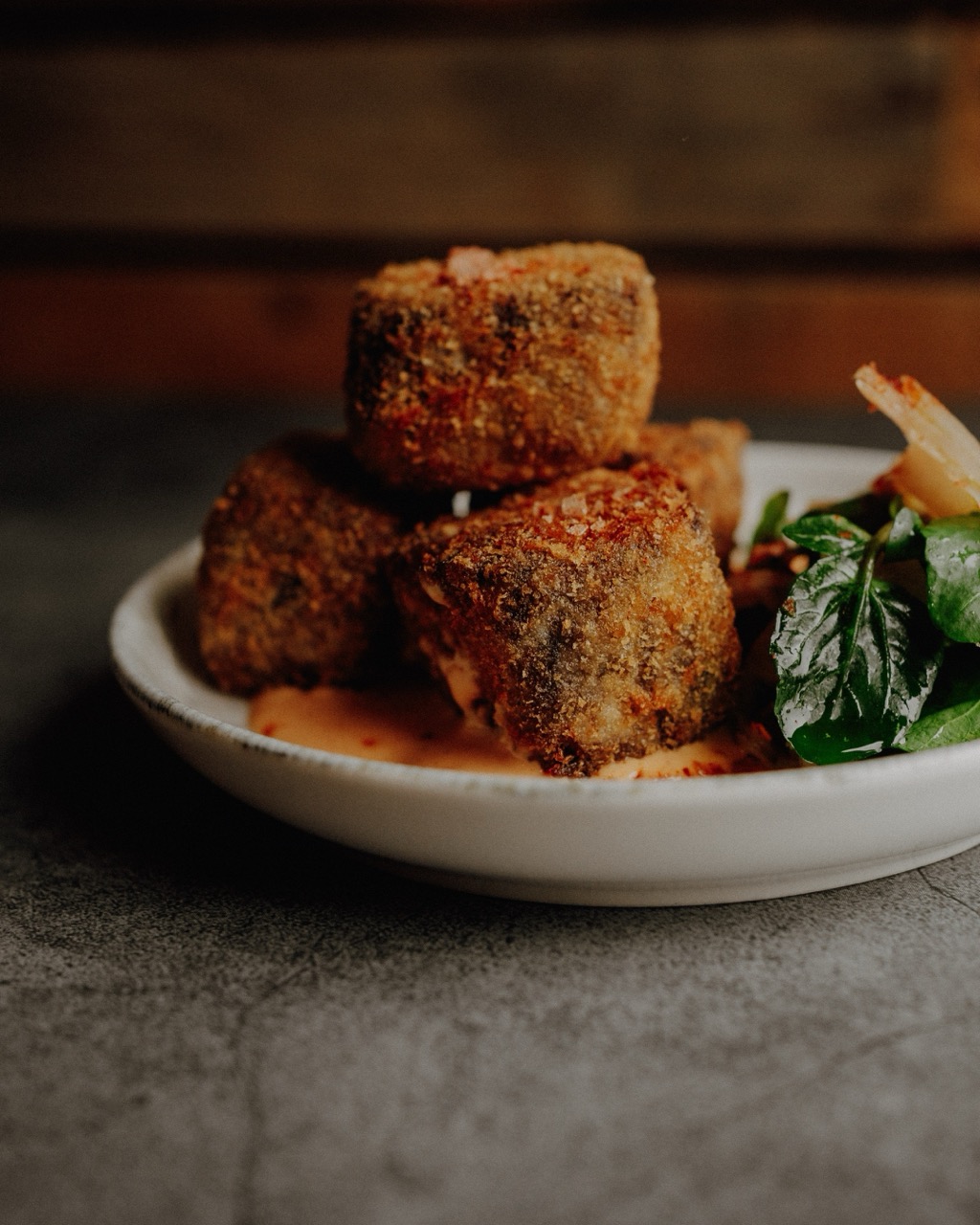 http://Beef%20short%20rib%20croquettes%20on%20a%20small%20plate.