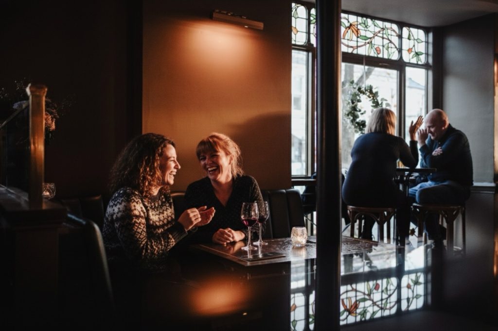 Untitled design - 1 - The Montpellier Wine Bar & Bistro Women enjoying a glass of wine at the wine bar